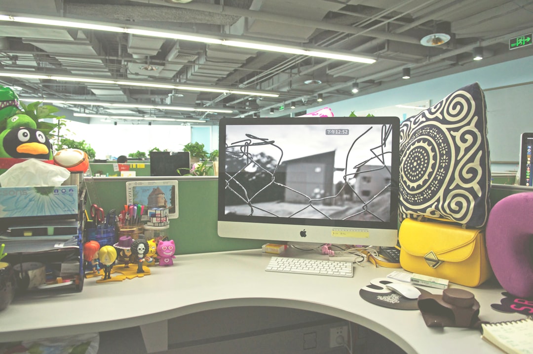 Creative workspace with Fontlu displayed on monitor